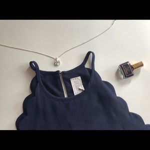 Scalloped high neck sleeveless top